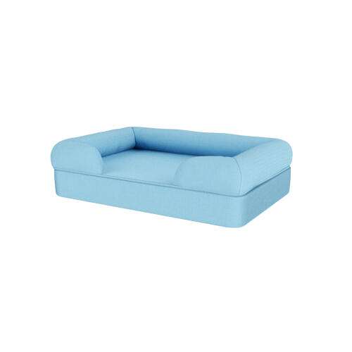 Una cama para perros de espuma con memoria de color azul claro.