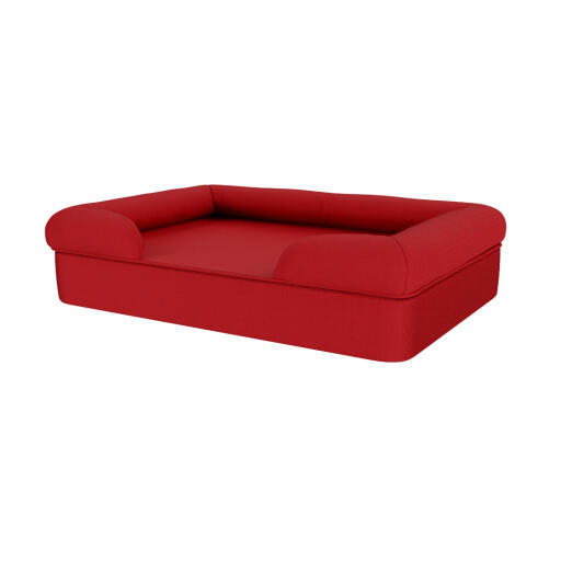 Una cama roja para perros de espuma con memoria.